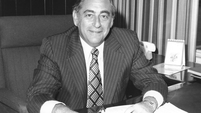Harvey Chaplin sitting at his desk.